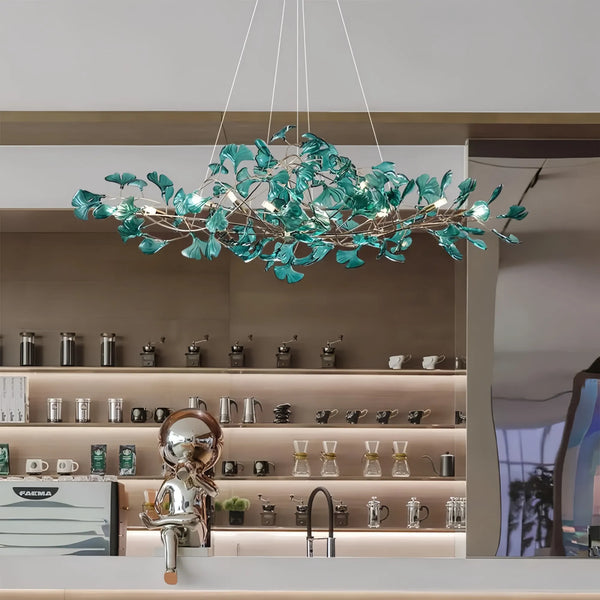 Modern green ginkgo chandelier with leaf-like design for kitchen counter.