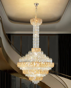 Luxury chandelier installation in high-ceiling entrance area