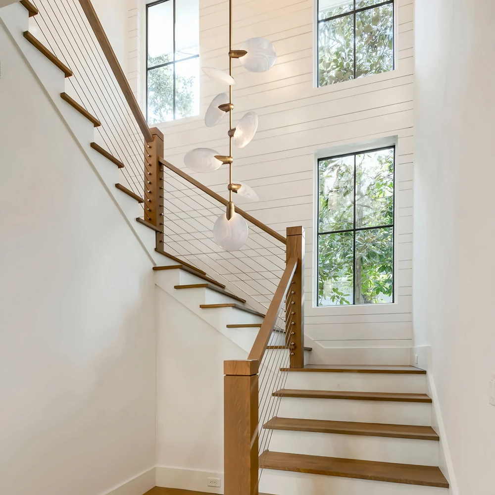 Lyla Pendant chandelier hanging in staircase with modern alabaster design