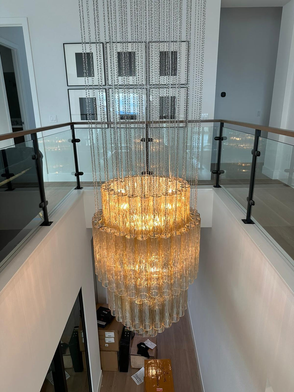 Decorative interior with ornate wall pieces, a chandelier, and a staircase.